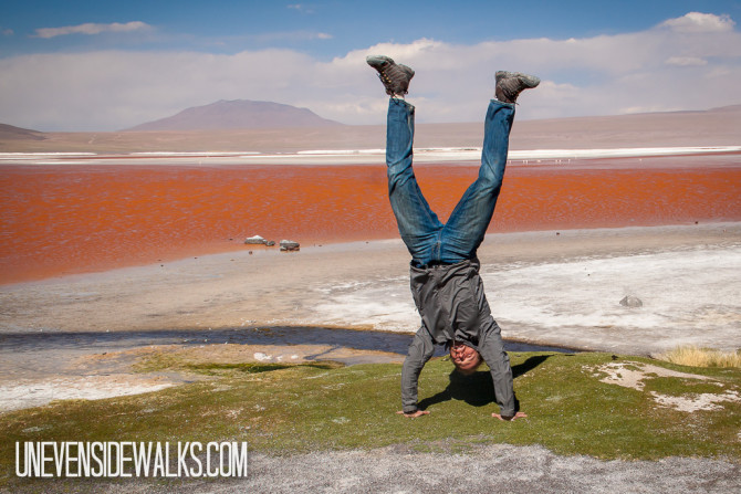 Landon doing a Handstand by the red waters of Laguna Colorado